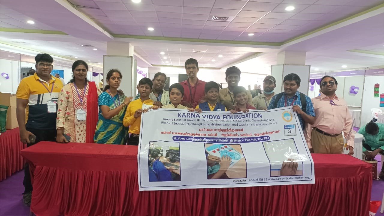 children and KVF staff holding KVF banner 