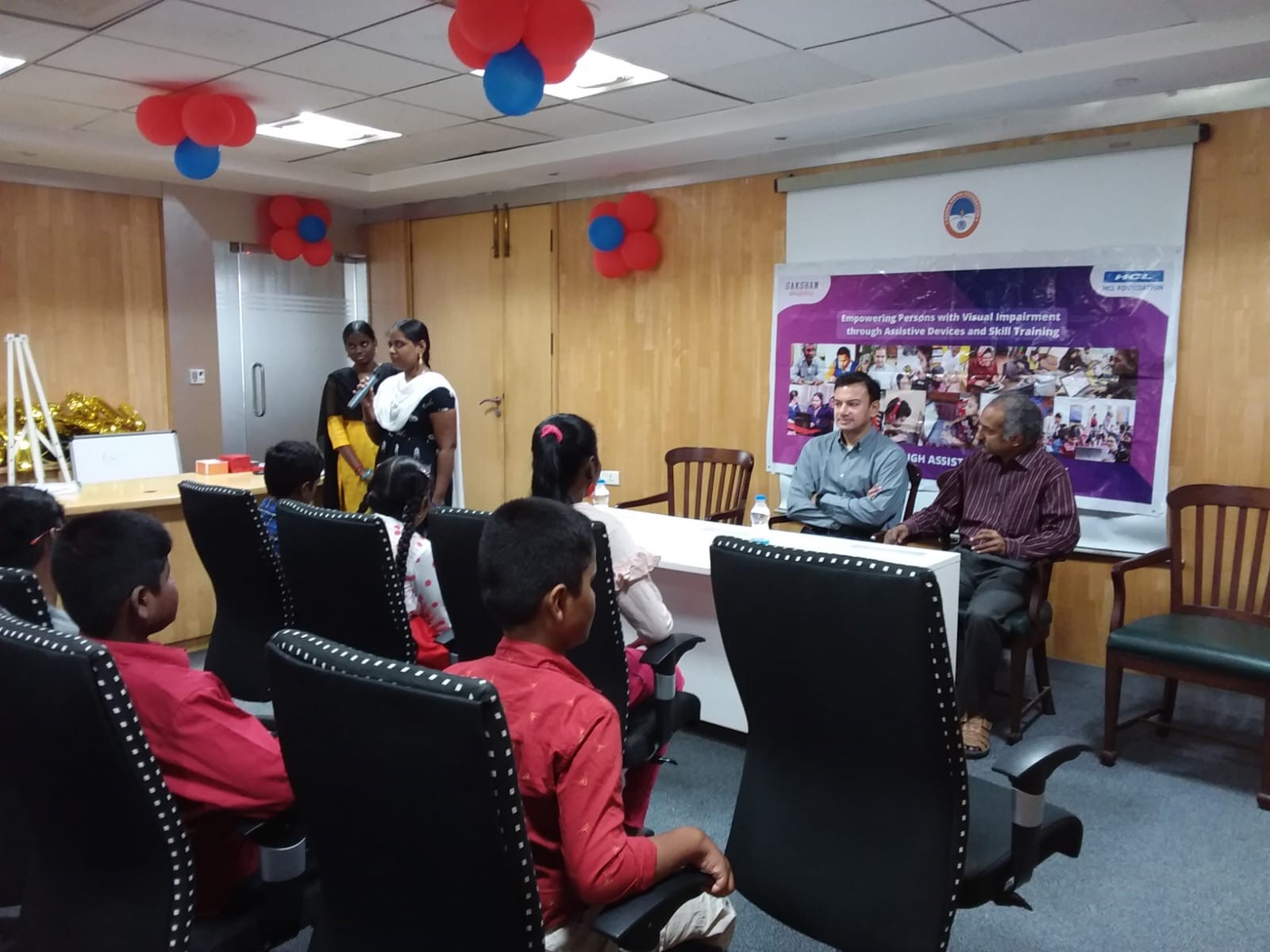 Children as audience and dignitaries listening to the speech being delivered